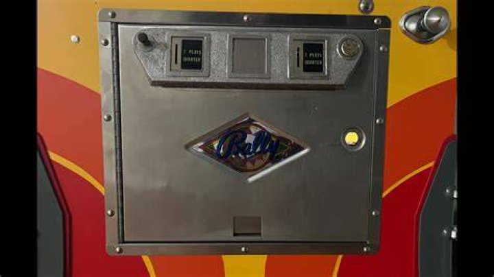 Opening for a token on a pinball machine
