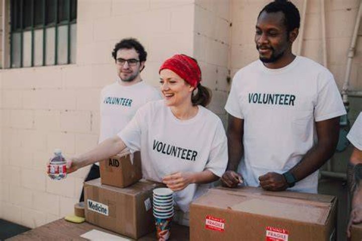 Perform a charitable act like volunteering: 2 wds.